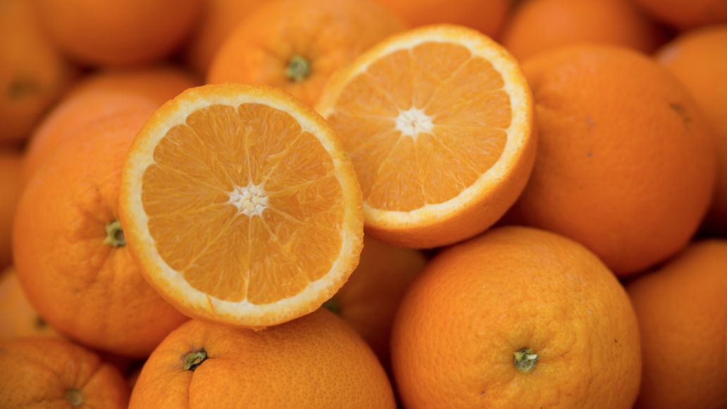 A close up of a pile of oranges